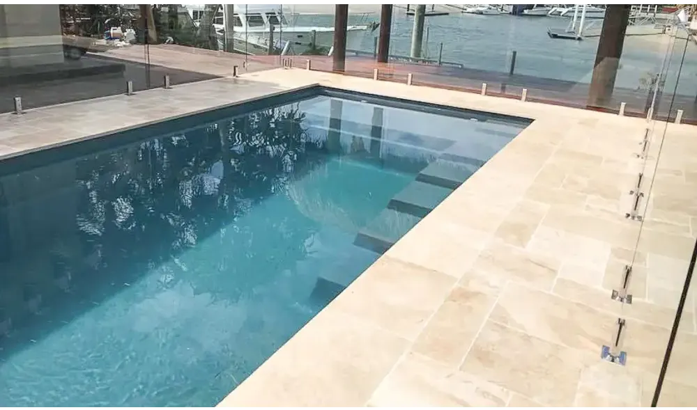 Leisurepools Elite pool – rectangular shape, modern design, turquoise water, beige stone