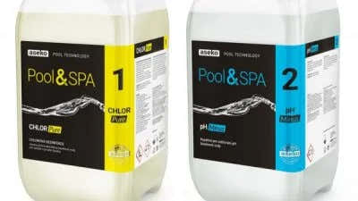 Two white plastic containers labelled Pool & Spa – black, yellow and blue labels with a wave design