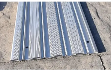 Silver metal pool deck ramp with additional rails for a Nivokit Galant pool enclosure