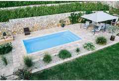 Aruba fibreglass pool – rectangular shape, clear blue water, glass balustrade