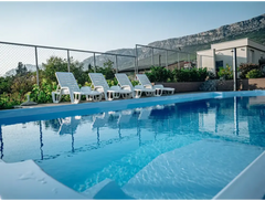 Barbados fibreglass pool – white plastic loungers, for special events
