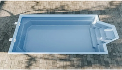 Grenada fibreglass pool – light blue finish, distinctive shape, comfortable seating