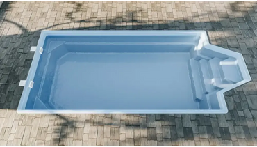 Grenada fibreglass pool – light blue finish, distinctive shape, comfortable seating