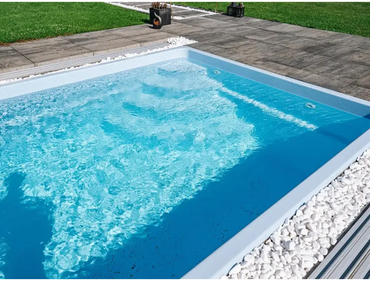 Papeete fibreglass pool – modern design, pool enclosure, rectangular shape, clear blue water, white stones