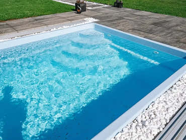 Papeete fibreglass pool – modern design, clear blue water, white stones