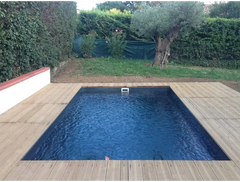 Saba fibreglass pool – rectangular shape, deep blue water, wooden deck