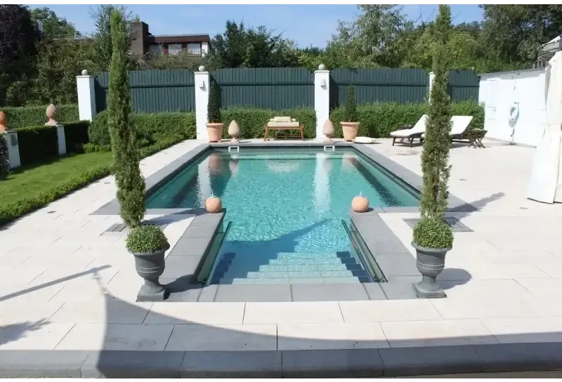 Rustica Nevada coping stone set – turquoise water, light grey stone paving