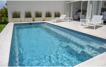 Leisurepools Harmony pool – rectangular shape, clear blue water, white-tiled edges