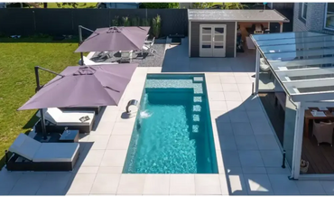 Rectangular pool – clear blue water, modern design, steps for access, visually striking design