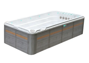 PassionSpa Activity 2 Deep swim spa – modern design, white interior, grey wood panels, tan stripes, blue LED lighting