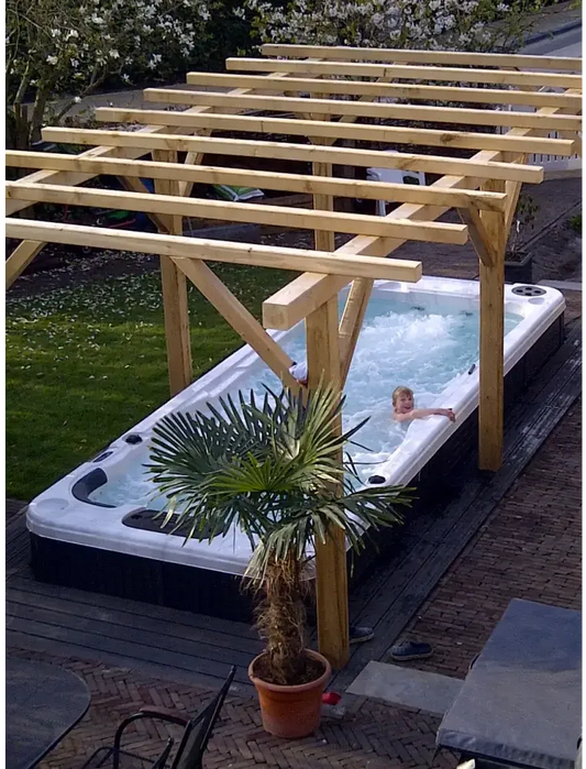 PassionSpa Aquatic 2 swim spa – white and black, bubbling water, pergola