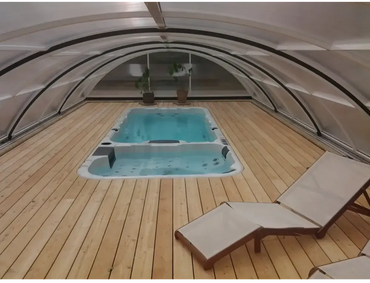 PassionSpa Aquatic 3 swim spa – light blue water, under a dome