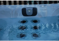 PassionSpa Desire hot tub – translucent white surface, Fisher logo