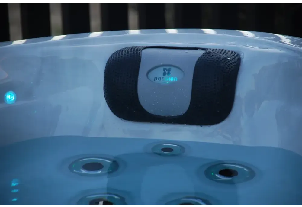 PassionSpa Desire hot tub – stylish design, black and grey speaker, blue Passion logo