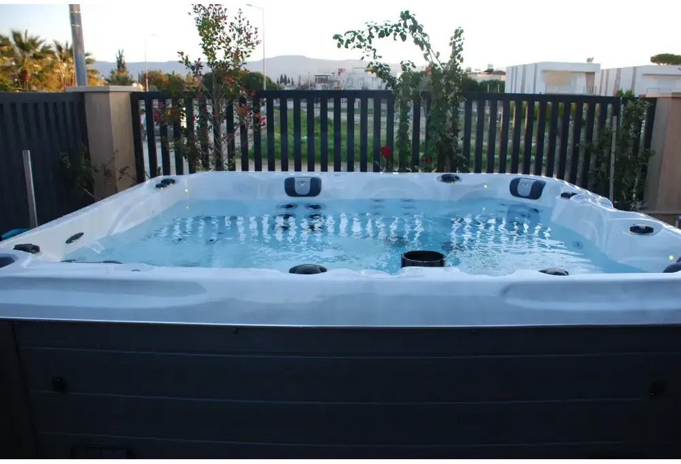 PassionSpa Desire hot tub – white and grey, blue water, black massage jets