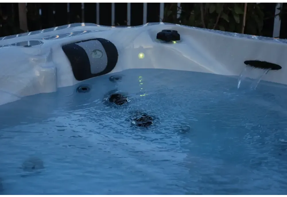 PassionSpa Desire hot tub – white interior, black panels, waterfall