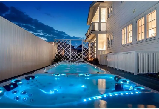 PassionSpa Energy swim spa – Sport Collection, blue lighting, black massage jets