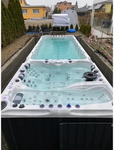 PassionSpa Energy swim spa – Sport Collection, white and black, modern design, seating, massage jets, LED lighting