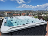 PassionSpa Euphoria Mighty Wave hot tub – white and dark grey, blue water, massage jets