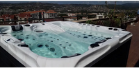 PassionSpa Euphoria Mighty Wave hot tub – white finish, black accents, bubbling water, turquoise water