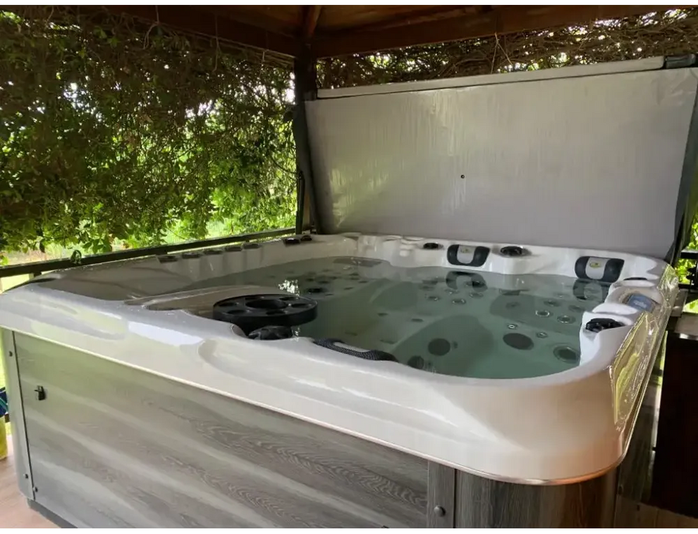 PassionSpa Euphoria Mighty Wave hot tub – white finish, white interior, grey wood panels, black massage jets