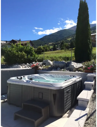PassionSpa Euphoria Mighty Wave hot tub – white and grey, mountain view