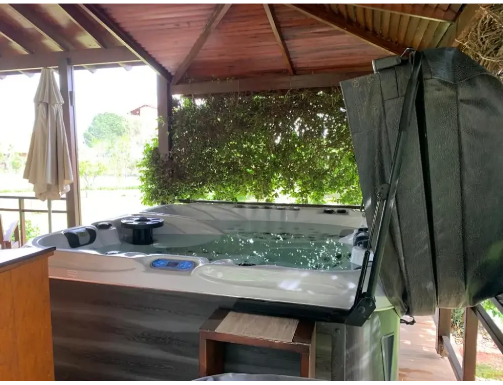 PassionSpa Euphoria Mighty Wave hot tub – white and grey, black panel, green cover