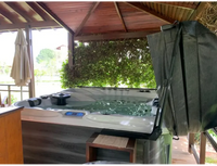 PassionSpa Euphoria Mighty Wave hot tub – white and grey, black panel, green cover