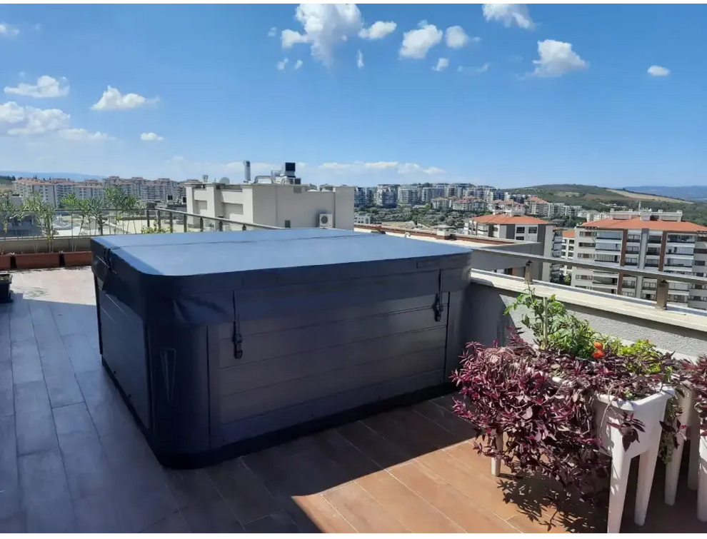PassionSpa Euphoria Mighty Wave hot tub – dark grey finish, cover, on a roof terrace