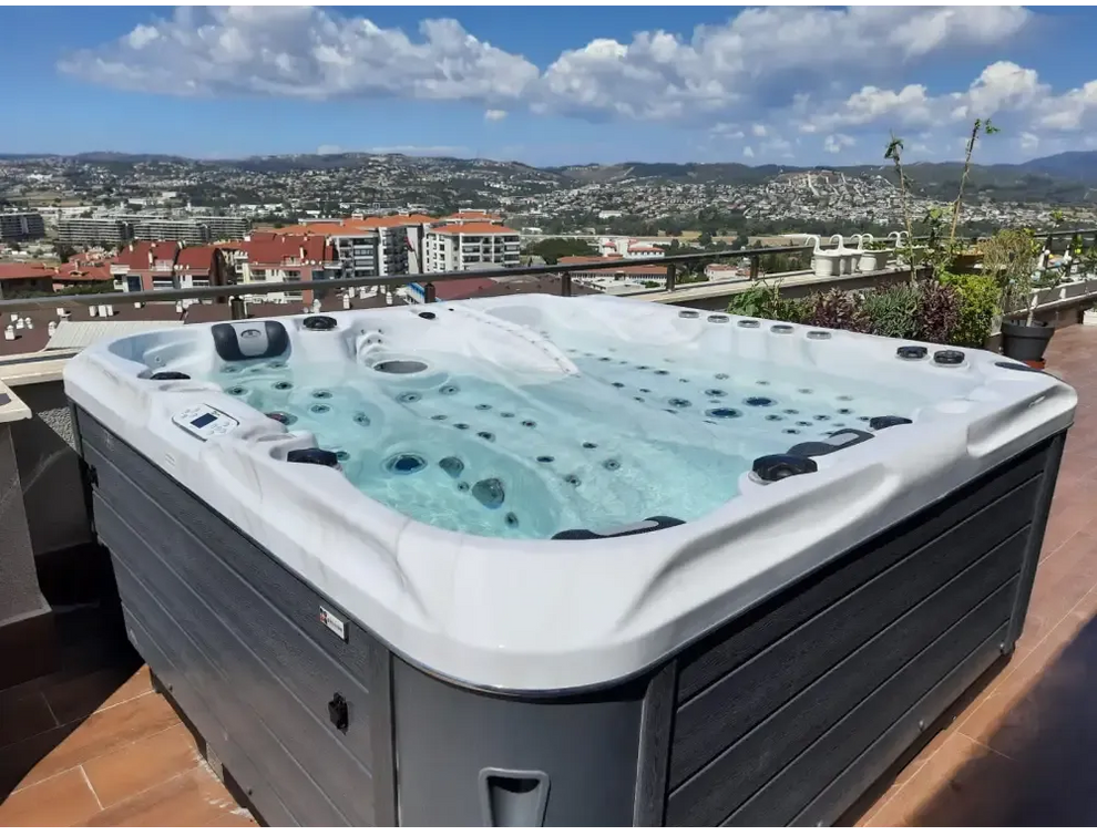 PassionSpa Euphoria Mighty Wave hot tub – white and grey, black massage jets, clear blue water