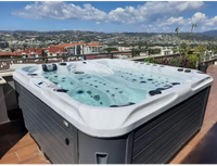 PassionSpa Euphoria Mighty Wave hot tub – white and grey, black massage jets, clear blue water