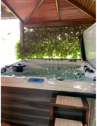 PassionSpa Euphoria Mighty Wave hot tub – white finish, white interior, black massage jets, wood details