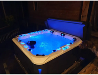 PassionSpa Felicity Mighty Wave hot tub – blue lighting, black and cream-coloured exterior, LED-lit edges