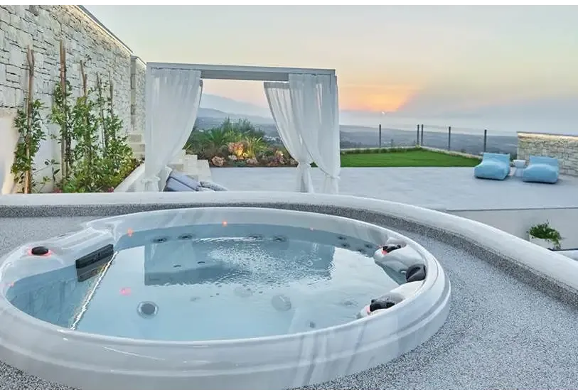 PassionSpa Recharge hot tub – Pure Collection, white finish, round shape, massage jets, red accents