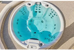 PassionSpa Recharge hot tub – Pure Collection, white finish, turquoise water, black massage jets