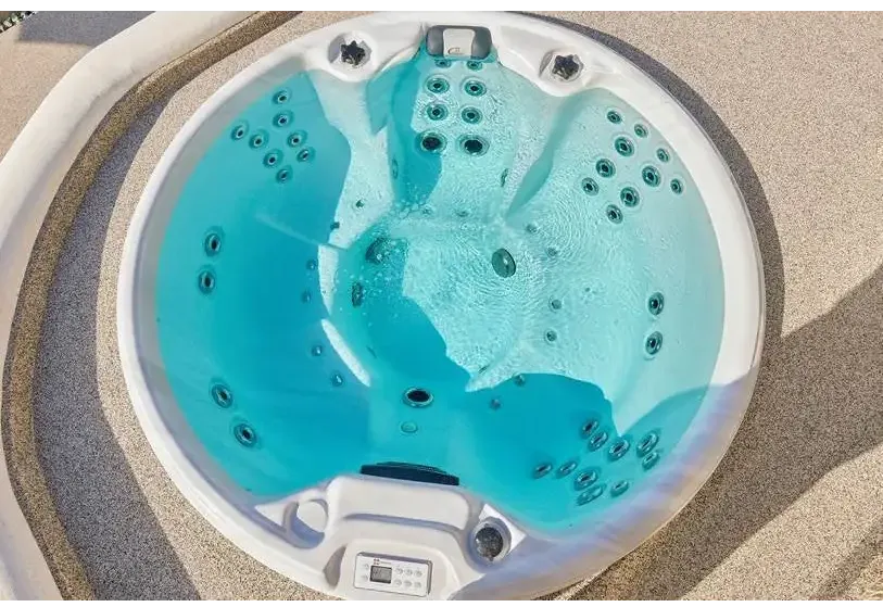 PassionSpa Recharge hot tub – Pure Collection, white finish, turquoise water, black massage jets
