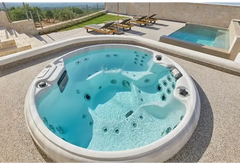 PassionSpa Recharge hot tub – Pure Collection, white finish, turquoise water, massage jets