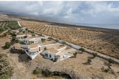 PassionSpa Recharge hot tub – Pure Collection, modern white villas with stone and terracotta among olive groves