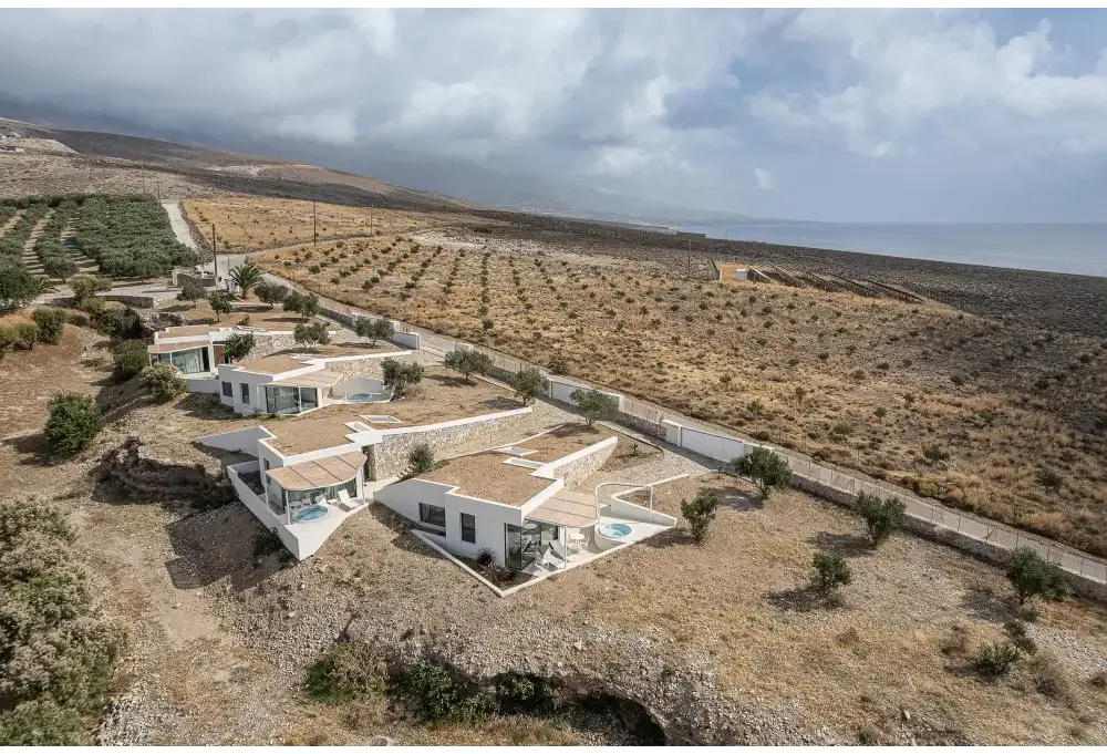 PassionSpa Recharge hot tub – Pure Collection, modern white villas with stone and terracotta among olive groves