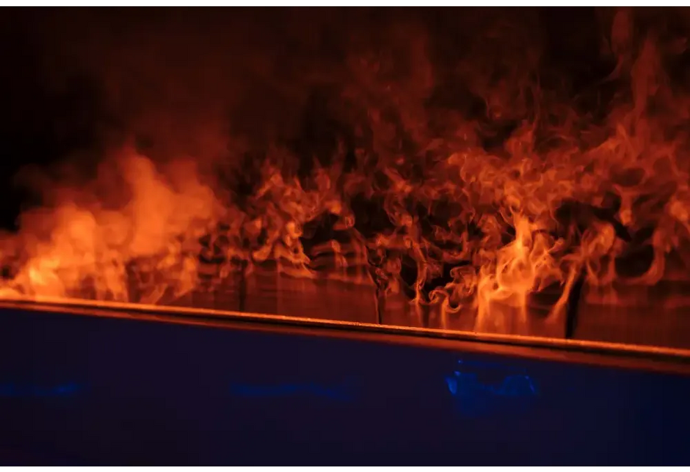 PassionSpa Serene 6 hot tub – fireplace, orange flames, dark surface