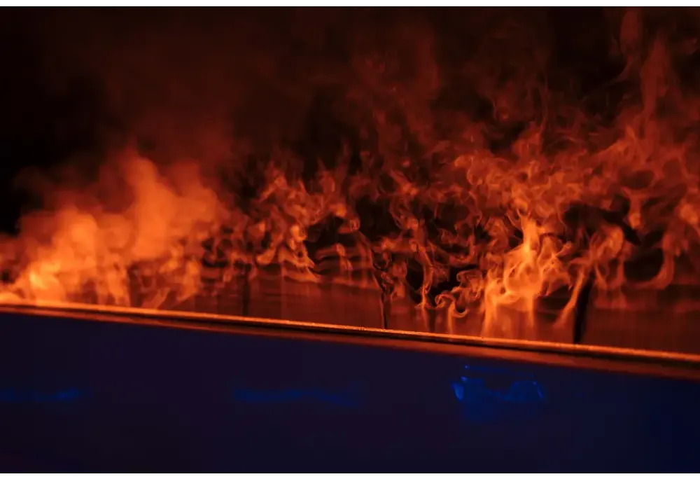 PassionSpa Serene 6 hot tub – fireplace, orange flames, dark surface