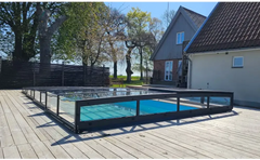 Icon Kit pool enclosure – modern design, transparent enclosure, black frame, blue water