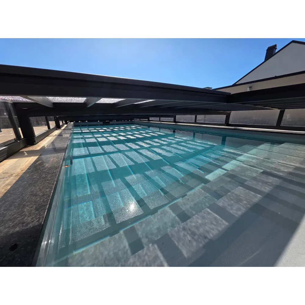 ICON KIT S3 pool enclosure – 4 x 9, elongated shape, rectangular pool, clear turquoise water, modern black pool enclosure, anthracite finish