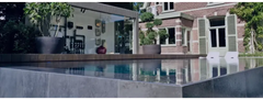 Above-ground PP pool in 20 mm material with a skimmer – stylish design, infinity edge, grey stone paving