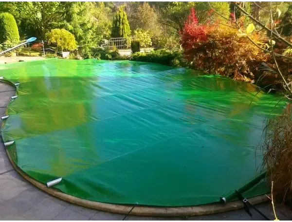 Green pool cover including a manual operating unit – glossy surface