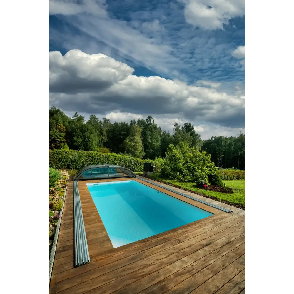 Rektangulär Thermopp Poolpaket Qbig med klart blått vatten och glastak