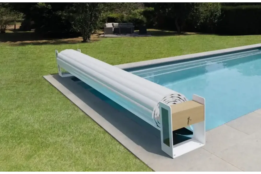 White Top ONE slatted pool cover with an above-ground roller – wooden cabinet, metal frame