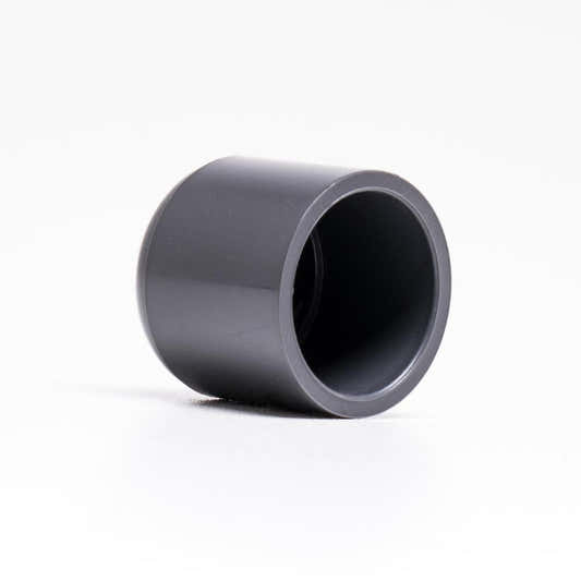 PVC end cap with a solvent-weld connection